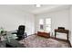 Office space with desk, two windows, area rug, and bright white paint at 1219 Driftwood Dr, Carmel, IN 46033