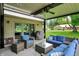 Relaxing covered outdoor patio with comfortable seating, perfect for entertaining or enjoying the backyard at 1219 Driftwood Dr, Carmel, IN 46033