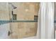 Shower features decorative tile, linen closet, rain shower head, hand held shower attachment, and niche at 1219 Driftwood Dr, Carmel, IN 46033