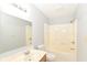 Bright bathroom features a combined shower and tub unit and a wide vanity at 12289 Charing Cross Rd, Carmel, IN 46033