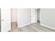 Bright bedroom boasts modern flooring and a doorway to an adjacent room at 12289 Charing Cross Rd, Carmel, IN 46033