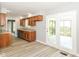 Well-lit kitchen featuring wood cabinets, granite countertops, and stainless steel appliances at 12289 Charing Cross Rd, Carmel, IN 46033