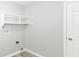 Cozy laundry area featuring new shelves and a functional utility connection at 12289 Charing Cross Rd, Carmel, IN 46033