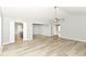 View of open living space with hardwood floors, ceiling fan, and neutral walls at 12289 Charing Cross Rd, Carmel, IN 46033