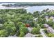 An aerial shot showcasing the lake community, with the home indicated with a red arrow at 13017 Water Ridge Dr, McCordsville, IN 46055