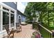 Outdoor deck with seating, flower planters, and a view of the backyard at 13017 Water Ridge Dr, McCordsville, IN 46055