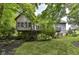 This backyard has a lush lawn, professional landscaping, a porch, and a walkout basement at 13017 Water Ridge Dr, McCordsville, IN 46055