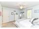 Cozy bedroom with a ceiling fan, a white dresser, and natural light at 13017 Water Ridge Dr, McCordsville, IN 46055