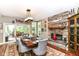 Dining room featuring a stone fireplace and a wooden dining table at 13017 Water Ridge Dr, McCordsville, IN 46055