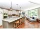 Spacious kitchen with island seating, modern appliances, and seamless flow into the cozy living area at 13017 Water Ridge Dr, McCordsville, IN 46055