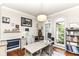 Bright home office with modern desk, beautiful millwork, arched windows, and hardwood floors at 13017 Water Ridge Dr, McCordsville, IN 46055