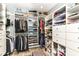 Spacious walk-in closet with custom shelving and a variety of storage options at 13017 Water Ridge Dr, McCordsville, IN 46055