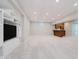 Finished basement with a carpet, recessed lighting, and a built-in entertainment unit at 13896 Fernleaf Way, Carmel, IN 46033