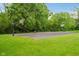 Outdoor basketball court with hoops set in a green space, perfect for sports and recreation at 13896 Fernleaf Way, Carmel, IN 46033