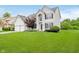 This two-story home offers a well-manicured lawn and traditional architectural details at 13896 Fernleaf Way, Carmel, IN 46033