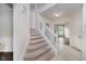 Bright foyer features carpeted stairs and neutral walls, creating a welcoming entrance at 13896 Fernleaf Way, Carmel, IN 46033