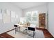 Bright home office features wood floors, modern desk, and neutral decor for productivity at 13896 Fernleaf Way, Carmel, IN 46033