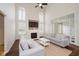 Living room with fireplace, high ceilings, plenty of natural light and hardwood floors at 13896 Fernleaf Way, Carmel, IN 46033
