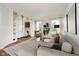 Tastefully decorated living room with neutral tones, stylish furniture and hardwood flooring at 13896 Fernleaf Way, Carmel, IN 46033