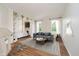 Stylish living room featuring modern furniture, hardwood floors, and lots of natural light at 13896 Fernleaf Way, Carmel, IN 46033