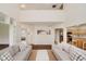 Open-concept living room with plush sofas, hardwood floors and plenty of natural light at 13896 Fernleaf Way, Carmel, IN 46033