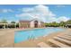 Community swimming pool with lounge chairs and a pool house, ideal for relaxing and enjoying the outdoors at 13896 Fernleaf Way, Carmel, IN 46033