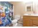 A full bathroom featuring a toy story themed shower curtain at 1452 Brookside N Ct, Columbus, IN 47201