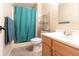 Bathroom featuring a toilet, vanity, and a shower with an blue shower curtain at 1452 Brookside N Ct, Columbus, IN 47201