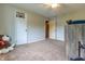 Bedroom featuring gray walls, ceiling fan, and a window providing natural light at 1452 Brookside N Ct, Columbus, IN 47201