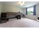 room with a bunk bed, rocking horse, and a large window providing natural light at 1452 Brookside N Ct, Columbus, IN 47201