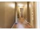 A carpeted hallway featuring tan colored walls and white trim and doors at 1452 Brookside N Ct, Columbus, IN 47201