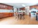 Eat-in kitchen with cherry cabinets, stainless steel appliances, and wood flooring at 1452 Brookside N Ct, Columbus, IN 47201