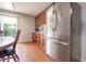 Bright modern kitchen with stainless steel fridge and view to outdoor through window at 1452 Brookside N Ct, Columbus, IN 47201