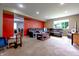 Spacious living room with a large sofa, carpeted floors, recessed lighting, and ample natural light at 1452 Brookside N Ct, Columbus, IN 47201