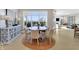Elegant dining room with a round table, comfortable chairs, and a decorative cabinet at 14877 Higgins Dr, Westfield, IN 46074