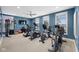 Well-equipped fitness center featuring treadmills and stationary bikes in a room with blue walls and natural light at 14877 Higgins Dr, Westfield, IN 46074