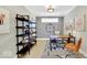 Functional home office space with a desk, shelving, and a comfortable chair at 14877 Higgins Dr, Westfield, IN 46074