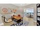 Bright home office featuring stylish decor, a desk, and a view into the dining room at 14877 Higgins Dr, Westfield, IN 46074