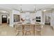 Bright kitchen featuring white cabinets, stainless steel appliances, and seating at the island at 14877 Higgins Dr, Westfield, IN 46074