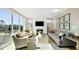 Stylish living room with a fireplace, comfortable seating, and access to an outdoor patio at 14877 Higgins Dr, Westfield, IN 46074