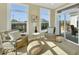 Cozy sun room with comfortable seating and plenty of natural light from large windows and sliding doors at 14877 Higgins Dr, Westfield, IN 46074
