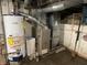 This basement features a Carrier furnace, a water heater, and visible ductwork at 1546 Wade St, Indianapolis, IN 46203