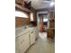 A compact kitchen with wooden cabinets at 1546 Wade St, Indianapolis, IN 46203