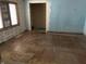 Living room undergoing renovation with refinished hardwood floors and natural light at 1546 Wade St, Indianapolis, IN 46203