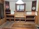 Open Living room featuring built-in wood shelving and hardwood floors at 1546 Wade St, Indianapolis, IN 46203