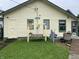 Rear exterior of home featuring a wooden swing set and small grassy yard at 1546 Wade St, Indianapolis, IN 46203