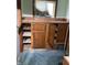 The storage has a small window and wooden cabinets with open shelves at 1546 Wade St, Indianapolis, IN 46203