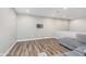 Open finished basement with wood flooring and mount for a flatscreen TV at 16071 Prince Ct, Noblesville, IN 46062