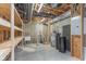 Unfinished basement with utility sink, water heater, and electrical panel ready for customization at 16071 Prince Ct, Noblesville, IN 46062