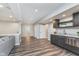 Finished basement featuring a wet bar with stainless steel appliances and open floorplan at 16071 Prince Ct, Noblesville, IN 46062